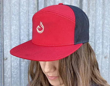 a woman wearing a red hat 7 panel