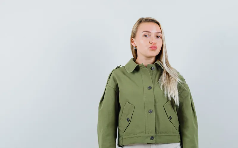 cropped jacket green wearing by blonde girl