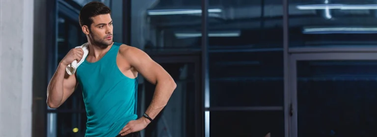 man wearing a green tank top