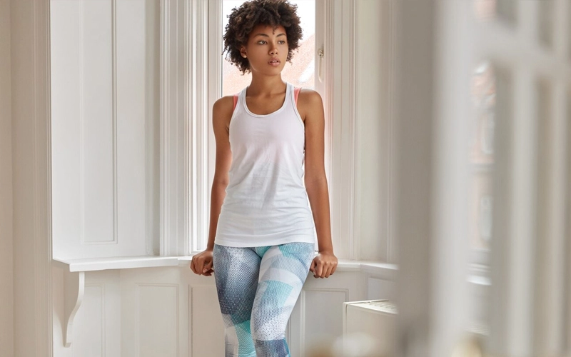 Woman wearing white cotton tank top