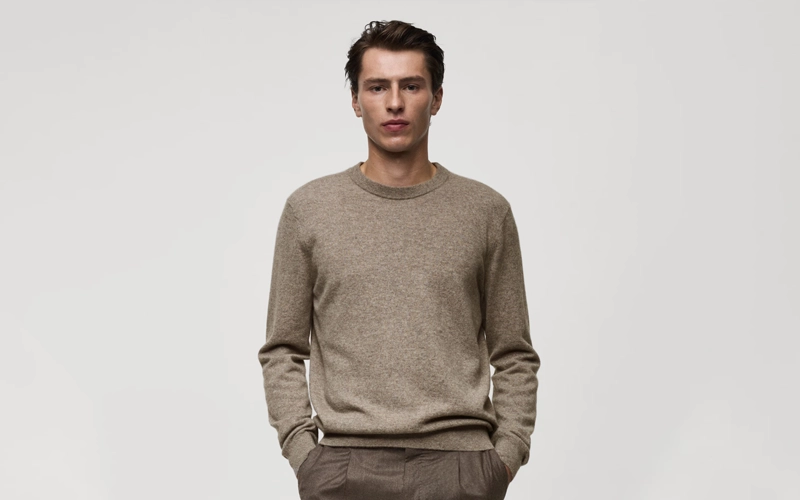a man wearing light grey color Cashmere sweater