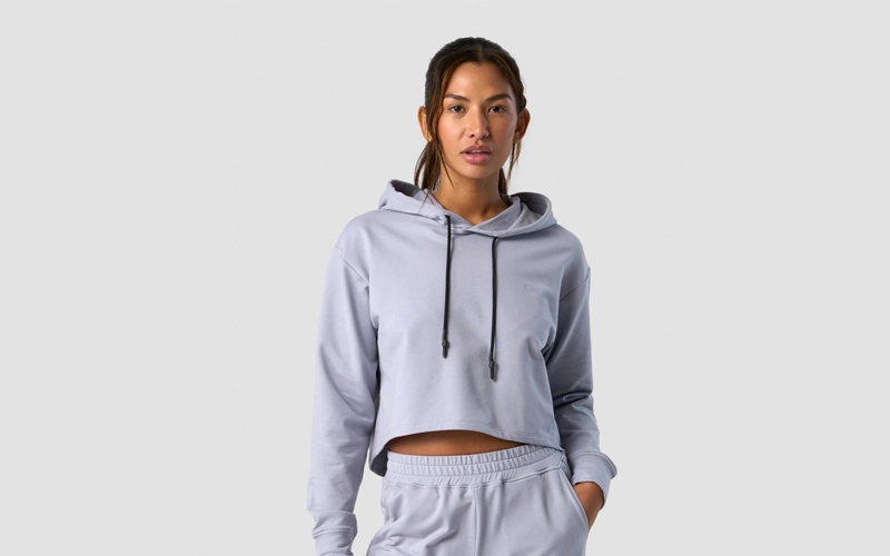 A women wearing light purplr cropped hoodie