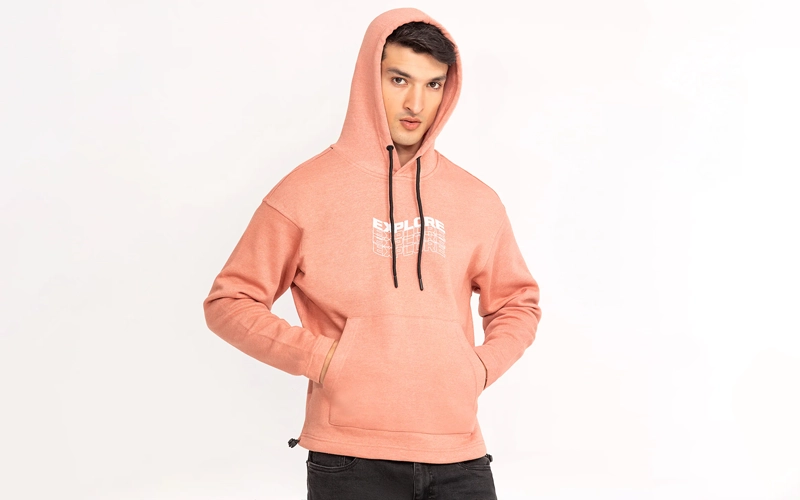 a man wearing pink color fleece hoodie