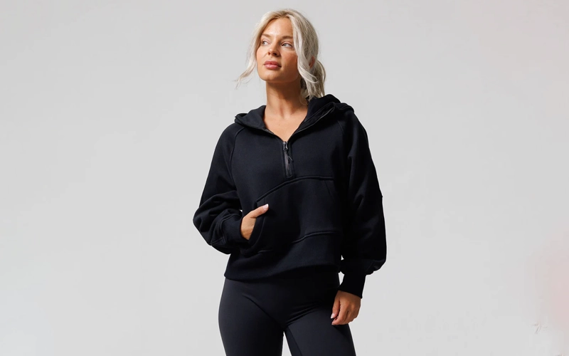 A blond wearing half zip up hoodie
