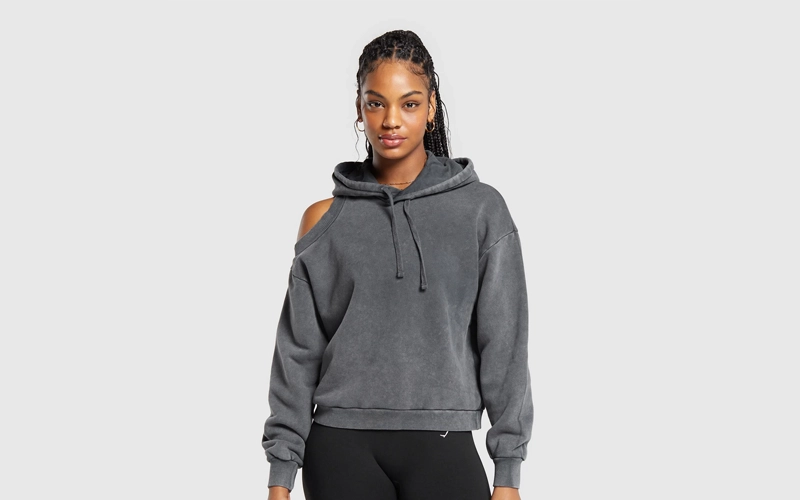 women wearing dark gray hoodie with cut out shoulder
