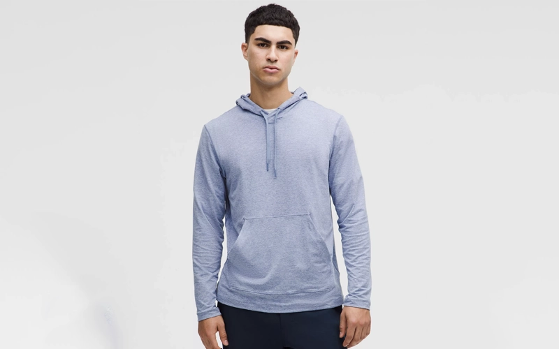 man wearing a light blue clour hoodie with hidden pockets