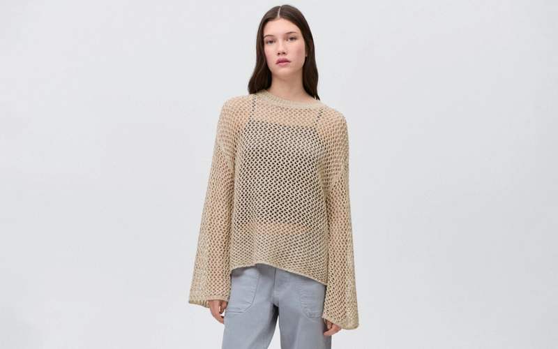 A women wearing skin Open Knit Sweater