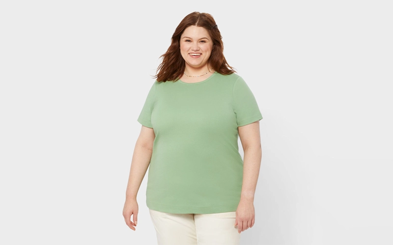 a bulky women wearing light green color Plus-size T-shirt