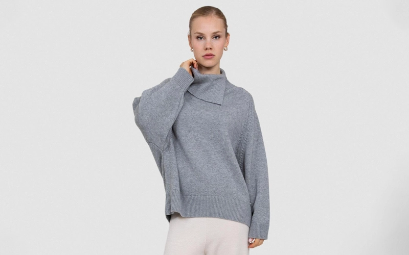 A women wearing light grey color Shawl Neck Sweater