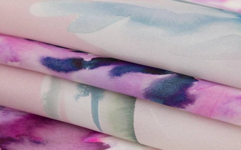 a silk fabric in a blend of white, light blue and light pink color
