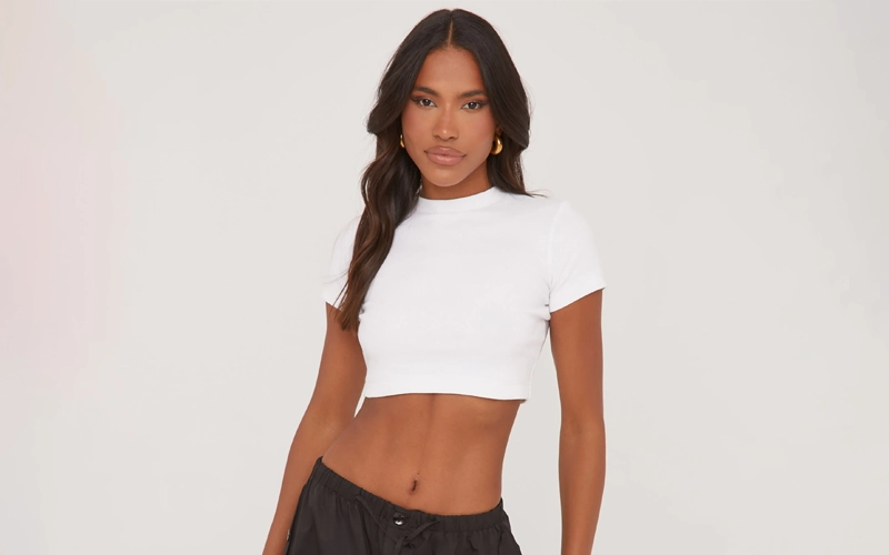 a black women wearing white color Trendy Crop T-shirt