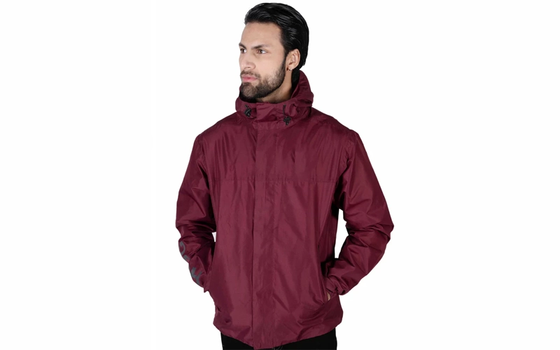 a man wearing burgendy color windbreaker hoodie