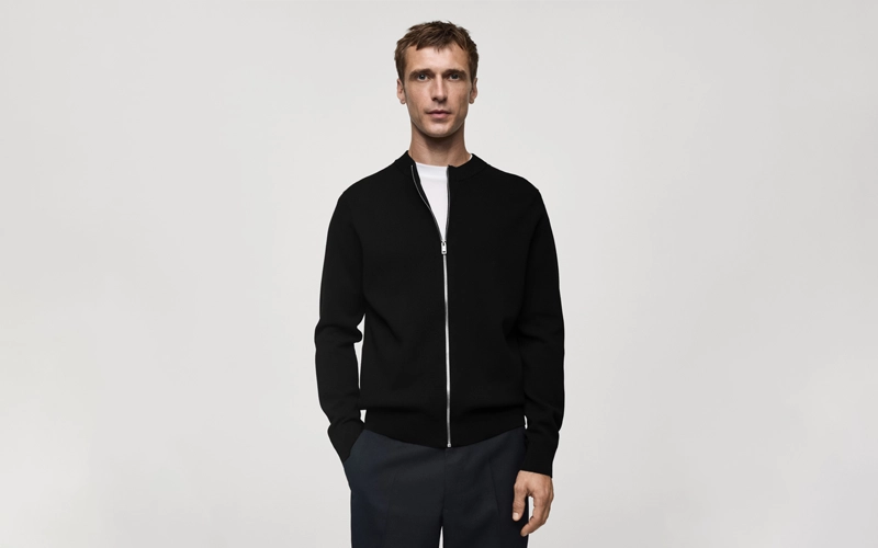 a man wearing a dark blue color cotton pant and a Zipped Cardigan